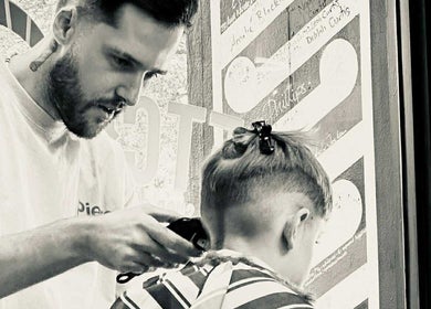 Stylist perfecting haircut at Jetcharm Barbershop & Gentlemen’s Quarters, New Plymouth, Taranaki Region, NZ.