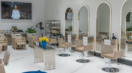 Elegant salon interior at Mustafa Asoglu Hair Design, Delray Beach, Florida, US, featuring modern styling chairs.