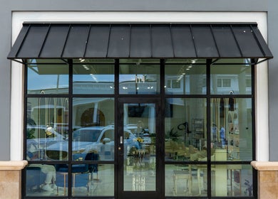 Front view of Mustafa Asoglu Hair Design in Delray Beach, Florida, US, showcasing modern entrance design.