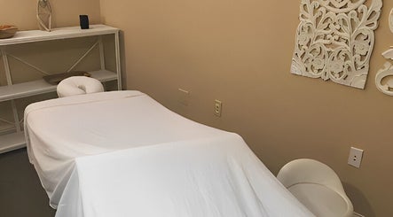 Cozy massage room at Placer Therapeutic Massage in Roseville, California, US with a well-prepared massage table.
