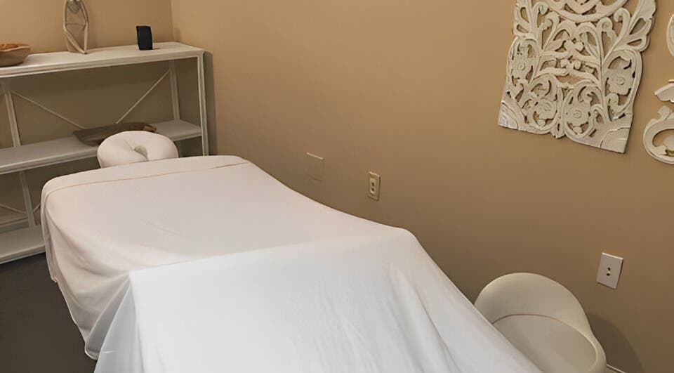 Cozy massage room at Placer Therapeutic Massage in Roseville, California, US with a white massage table.