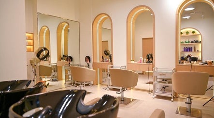 Elegant interior of Miss Keratin Beauty Salon in Dubai, AE showcasing stylish salon chairs and mirrors.