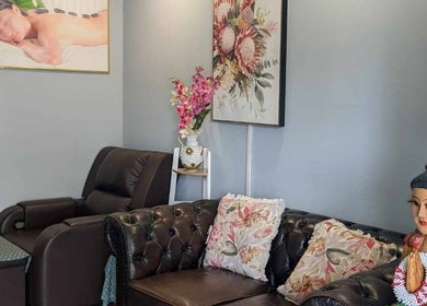 Relaxing interior of Nelson Bay Thai Massage, Nelson Bay, New South Wales, AU with floral decor and plush seating.