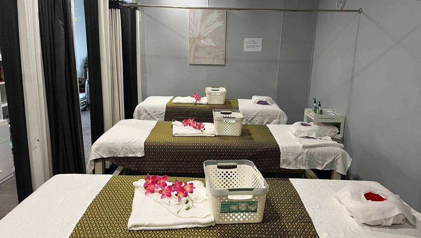 Relaxing massage tables at Nelson Bay Thai Massage, Nelson Bay, New South Wales, AU, adorned with flowers.