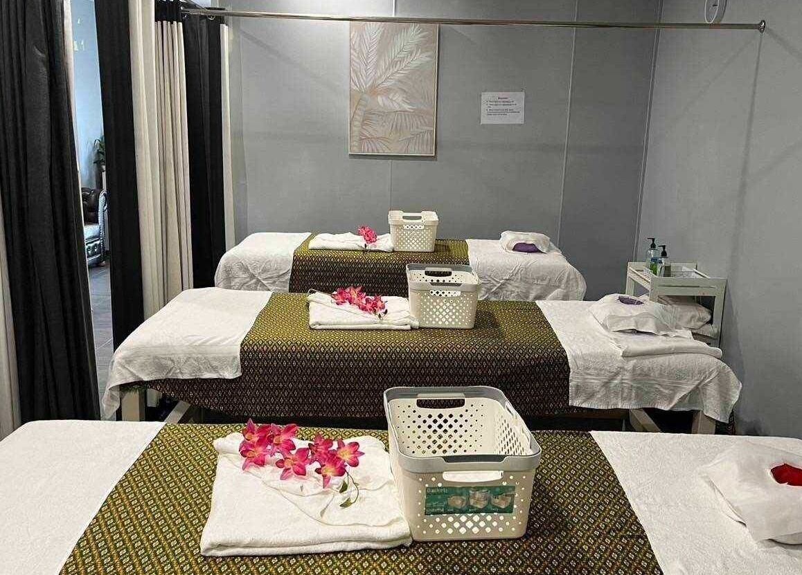 Relaxing massage tables at Nelson Bay Thai Massage, Nelson Bay, New South Wales, AU, adorned with flowers.