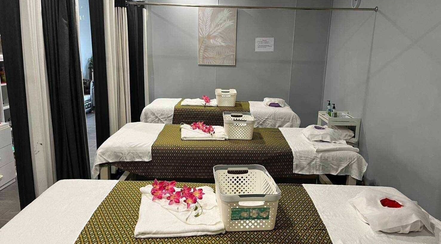 Relaxing massage tables at Nelson Bay Thai Massage, Nelson Bay, New South Wales, AU, adorned with flowers.