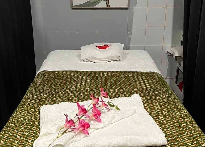 Massage bed at Nelson Bay Thai Massage, Nelson Bay, New South Wales, AU, with elegant floral decor.