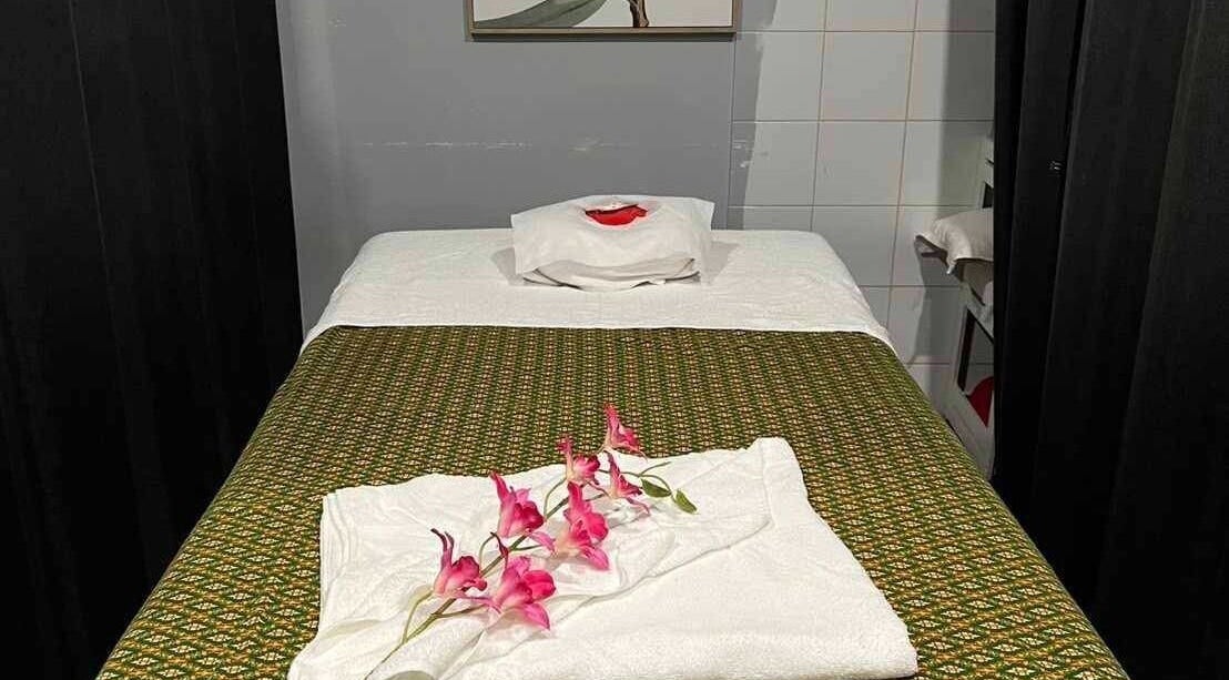 Massage bed at Nelson Bay Thai Massage, Nelson Bay, New South Wales, AU, with elegant floral decor.