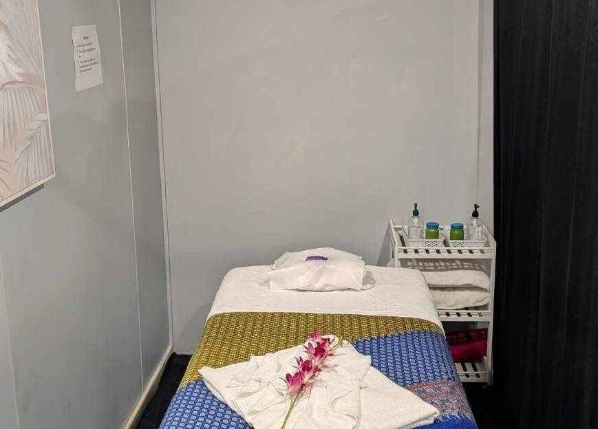 Massage room at Nelson Bay Thai Massage with a decorated bed in Nelson Bay, New South Wales, AU.