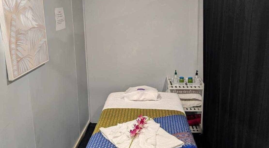 Massage room at Nelson Bay Thai Massage with a decorated bed in Nelson Bay, New South Wales, AU.