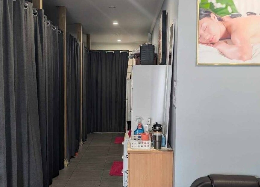 Tranquil corridor at Nelson Bay Thai Massage, Nelson Bay, New South Wales, AU with curtained spaces.