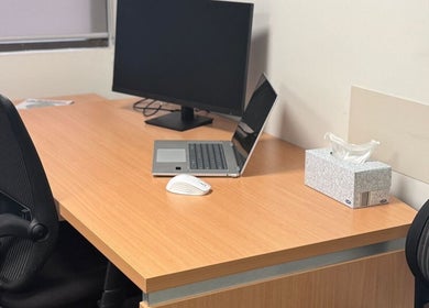 Professional workspace at Evaluate Physiotherapy, Liverpool, New South Wales, AU, with computer and chair.