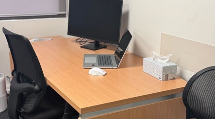 Professional workspace at Evaluate Physiotherapy, Liverpool, New South Wales, AU, with computer and chair.