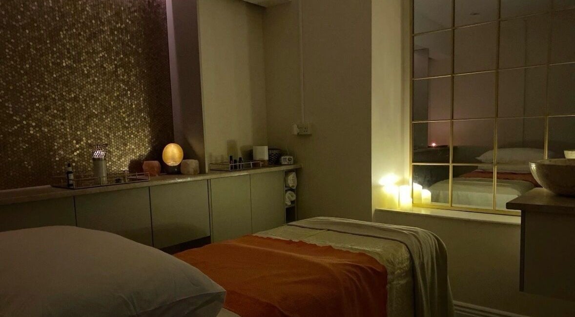 Relaxing massage room with ambient lighting at Tula Ayurveda in Frome, England, GB.