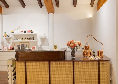 Reception area of Roses & More Skin Alchemy in Singapore, SG featuring elegant decor and beauty products.