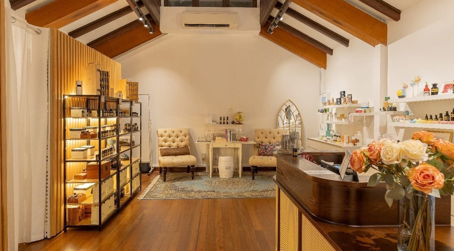 Inviting interior of Roses & More Skin Alchemy, Singapore, SG, showcasing plush seating and elegant decor.