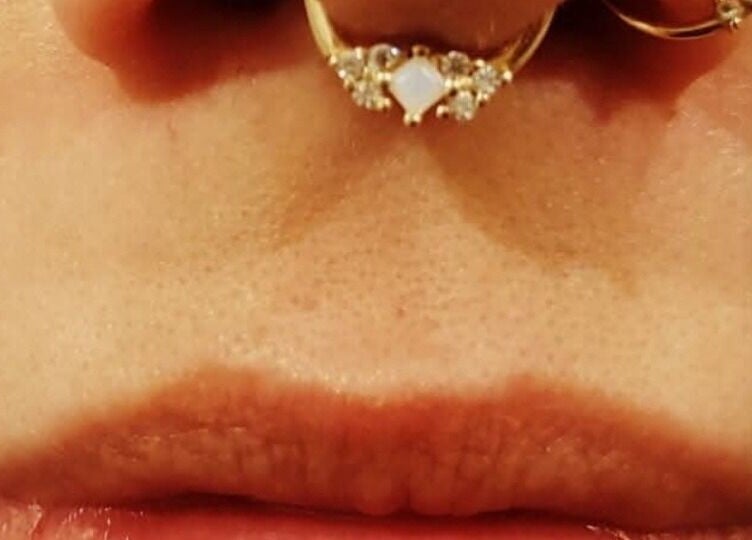 Dainty nose jewelry at Elysian Beauty and Piercing, Sudbury, GB showcasing unique piercing styles.