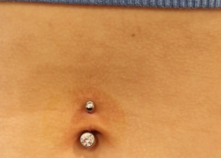 Stylish belly button piercing with gems at Elysian Beauty and Piercing, Sudbury, GB.