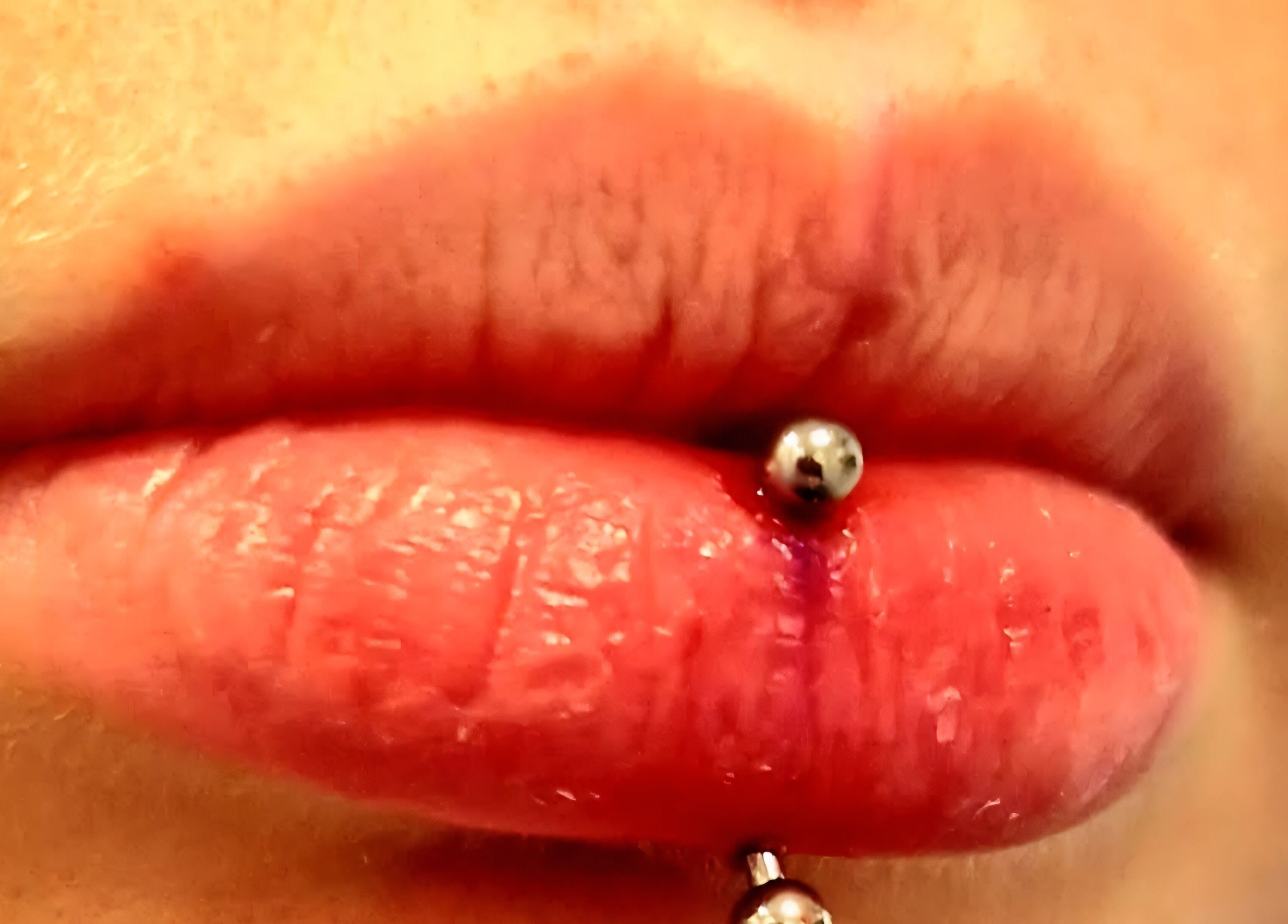Close-up of lip piercing at Elysian Beauty and Piercing, Sudbury, GB, highlighting expert craftsmanship.