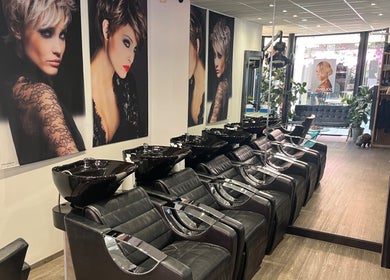 Sleek wash stations at Charlotte Miller Hair Design, Marlow, England, GB showcasing modern elegance.