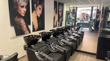 Sleek wash stations at Charlotte Miller Hair Design, Marlow, England, GB showcasing modern elegance.