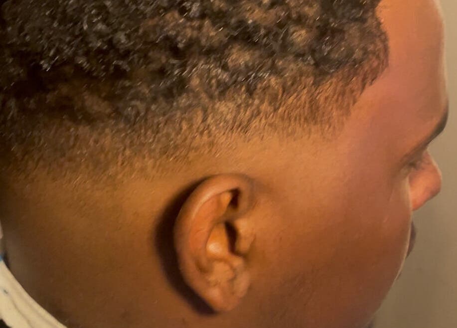 Close-up of a fresh fade haircut at Twistsby.Glo, Fredrikstad, Østfold, NO, showcasing expert styling.