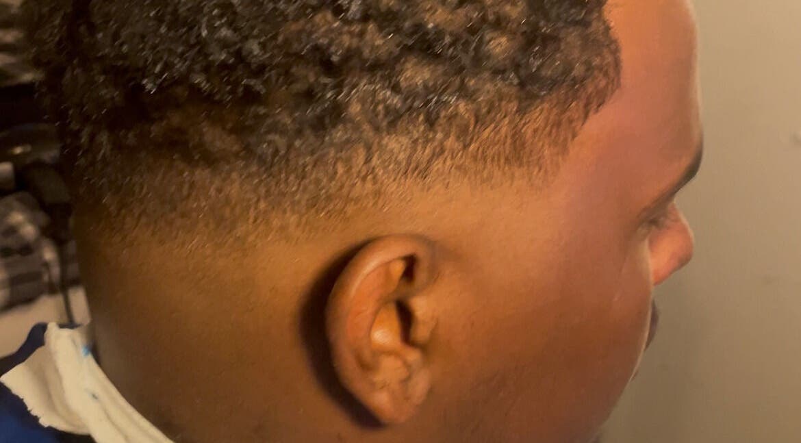 Close-up of a fresh fade haircut at Twistsby.Glo, Fredrikstad, Østfold, NO, showcasing expert styling.