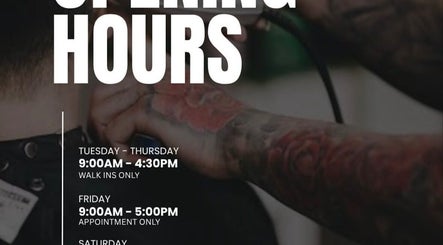 Tattooed barber at Yass_Fadez in Bexley, NSW, showcasing unique opening hours with professional grooming.