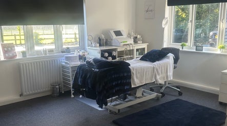 Treatment room at No. 4 Aesthetics & Beauty in St Albans, England, GB, featuring a cozy spa bed and tranquil decor.