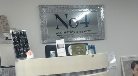Reception area at No .4 Aesthetics & Beauty, St Albans, England, GB with skincare products displayed.
