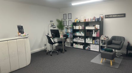 Modern interior of No .4 Aesthetics & Beauty in St Albans, England, with organized shelves and stylish furniture.