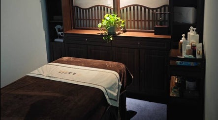 Relaxing therapy room at Better Wellness TCM 養正理疗馆, Orchard, SG, with massage table and soothing decor.