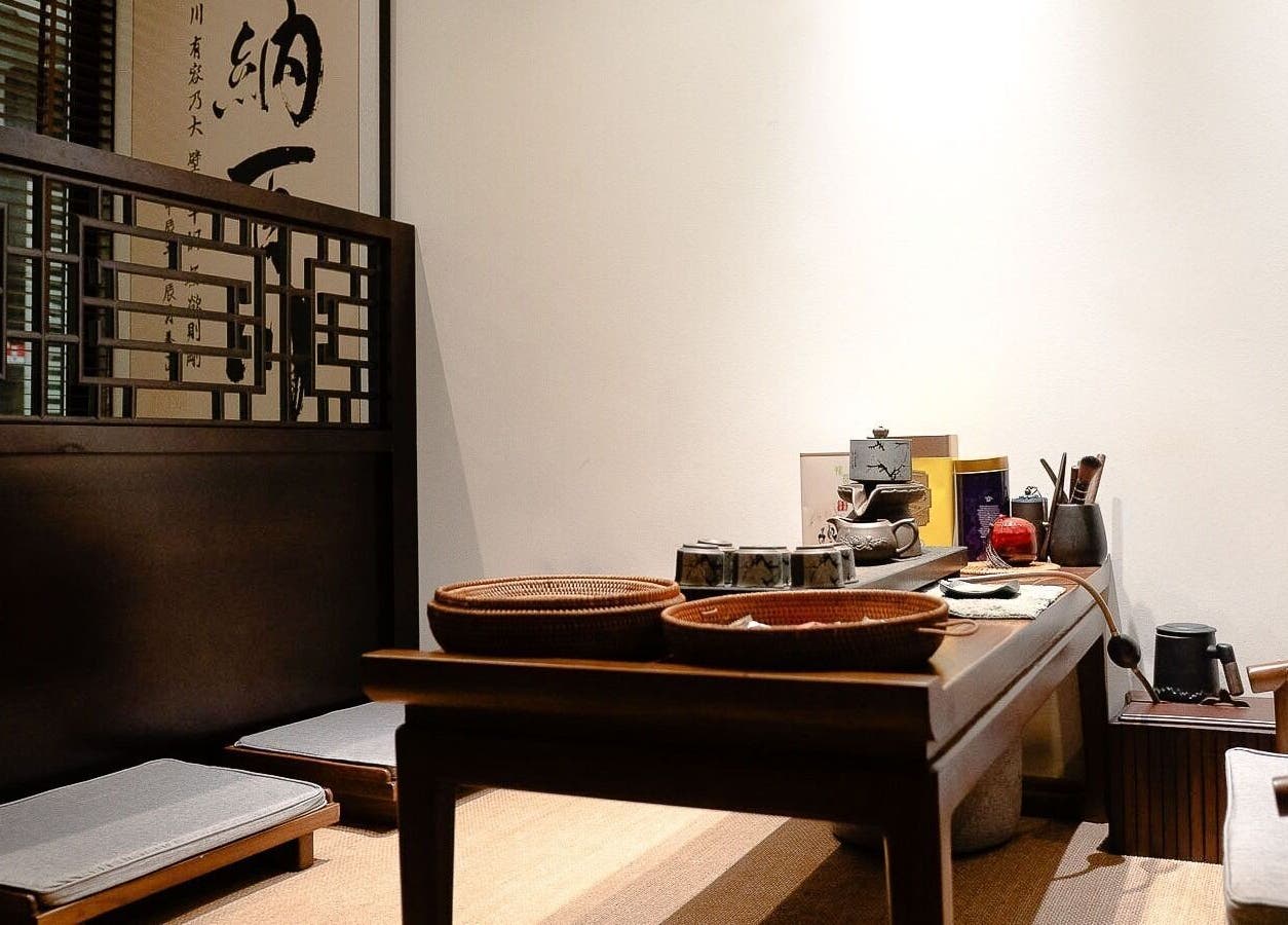 Cozy tea room at Better Wellness TCM 養正理疗馆, Orchard, SG, featuring traditional Asian decor and seating.