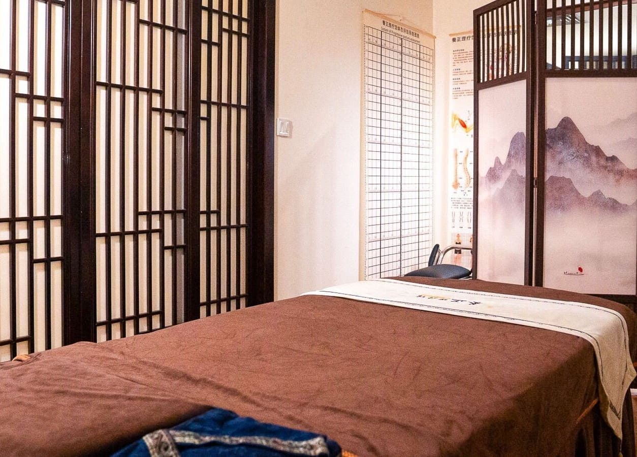 Serene therapy room at Better Wellness TCM 養正理疗馆 in Orchard, SG, featuring a massage table and calming decor.