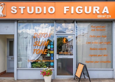 Front view of Studio Figura Ealing in London, England, GB, showcasing vibrant signage and welcoming entrance.