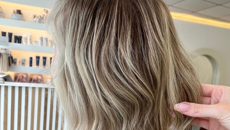 Stylish blonde hair waves styled at Hair By Chloe, Barnstaple, England, GB salon.