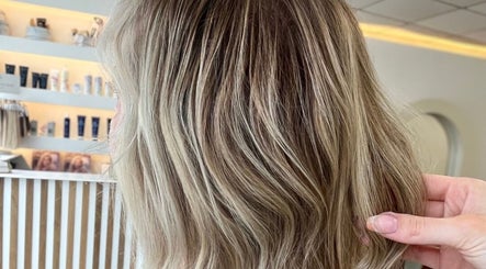 Stylish blonde hair waves styled at Hair By Chloe, Barnstaple, England, GB salon.