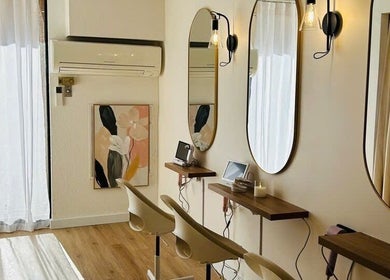 Elegant styling area at Ecosy Head Spa, Castle Hill, New South Wales, AU, featuring mirrors and chic decor.