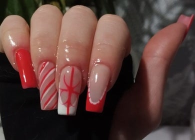 Elegant red and white nail art at Nails by Liv, Cheadle Hulme, England, GB, showcasing intricate design.