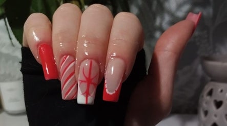 Elegant red and white nail art at Nails by Liv, Cheadle Hulme, England, GB, showcasing intricate design.