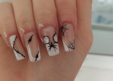 Creative spider web nail art at Nails by Liv, Cheadle Hulme, England, GB. Perfect for Halloween enthusiasts.