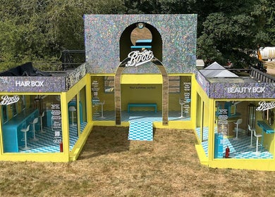 Boots Beauty Box at Beccles, England, GB. Vibrant salon setup with colorful seating and modern decor.