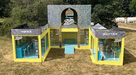 Boots Beauty Box at Beccles, England, GB. Vibrant salon setup with colorful seating and modern decor.