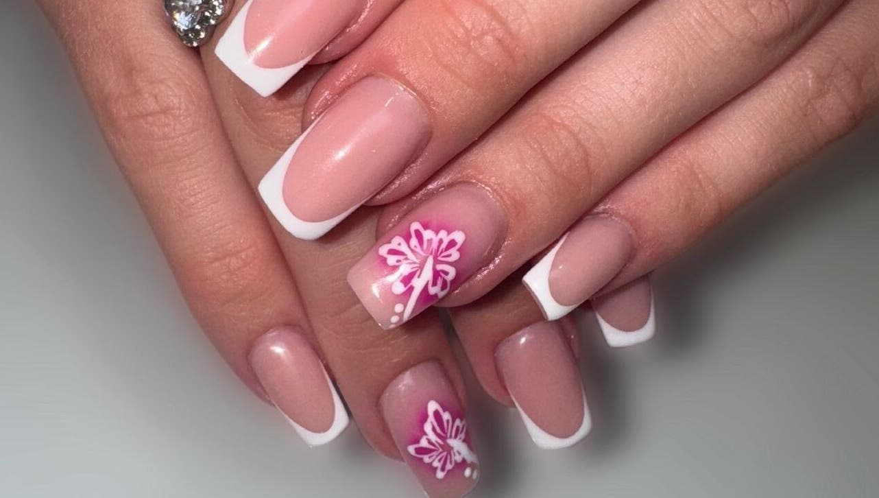 Elegant French manicure with floral art at Lindsey Marriott Nails, Blackpool, England, GB.
