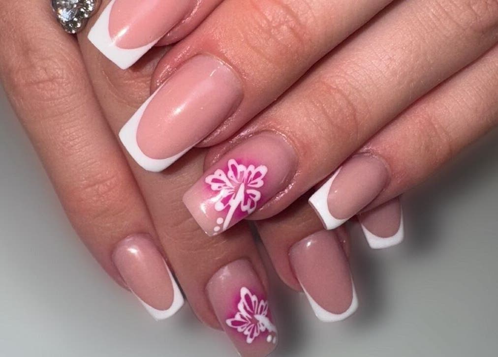 Elegant French manicure with floral art at Lindsey Marriott Nails, Blackpool, England, GB.