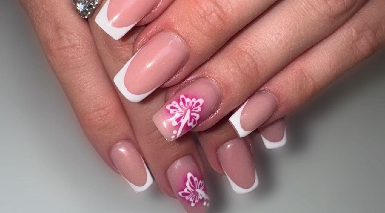 Elegant French manicure with floral art at Lindsey Marriott Nails, Blackpool, England, GB.