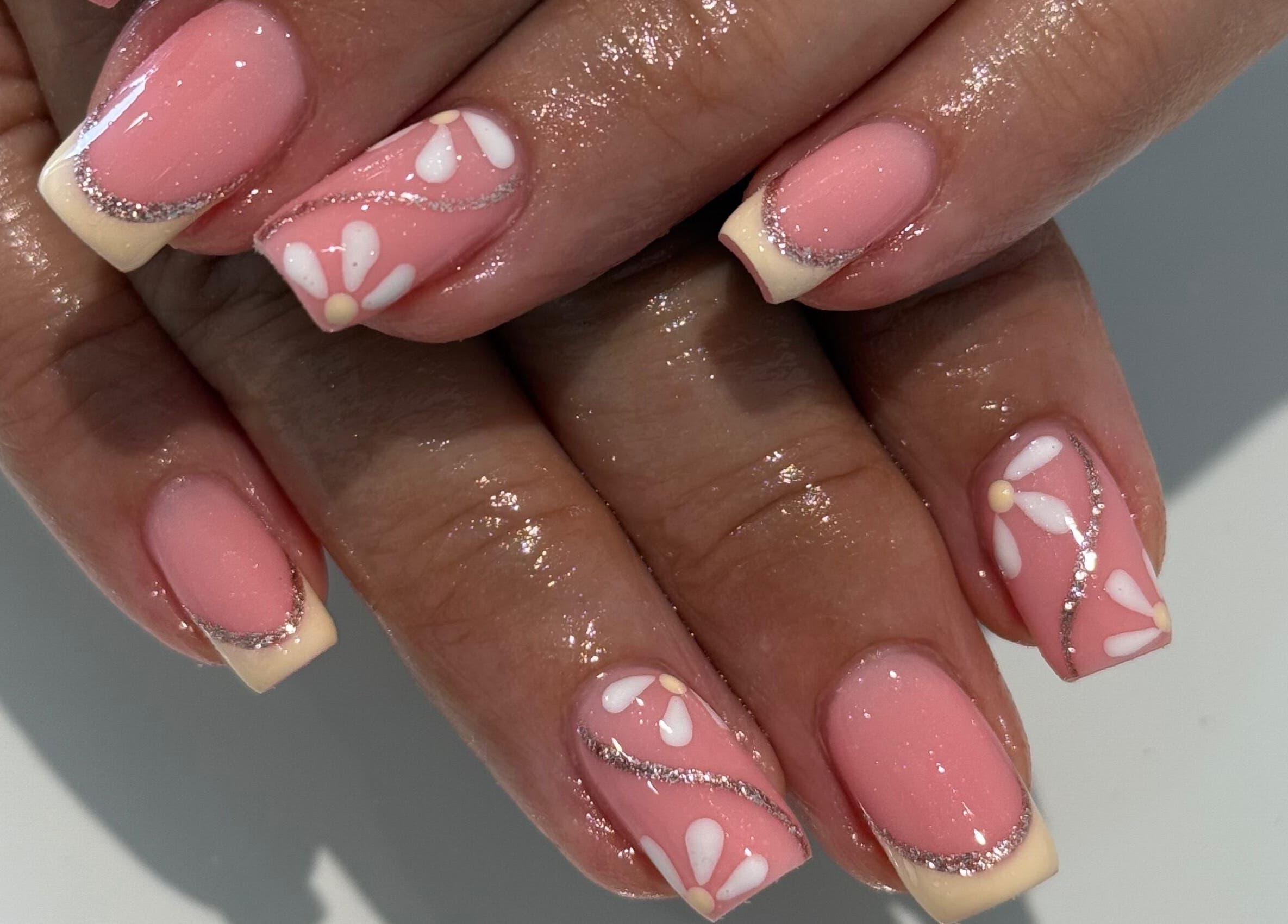 Elegant pink nails with floral design at Lindsey Marriott Nails, Blackpool, England, GB.