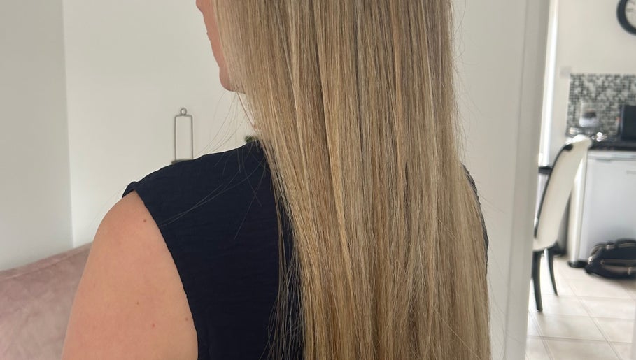 Long, silky blonde hair at The Extension Room by Ellie in Waterlooville, England, GB, showcasing salon results.