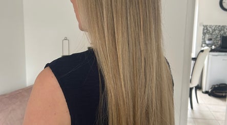 Smooth, blonde hair at The Extension Room by Ellie in Waterlooville, England, GB showcasing sleek salon results.