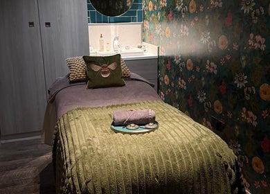 Cozy treatment room at Gina Conway Beauty, London, England, GB with elegant decor and inviting ambiance.